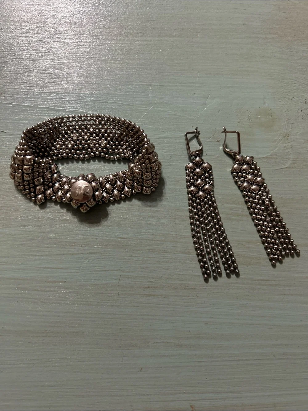 Sergio Gutierrez Liquid Metal Snap Bracelet W/ Matching Dangle Earrings.